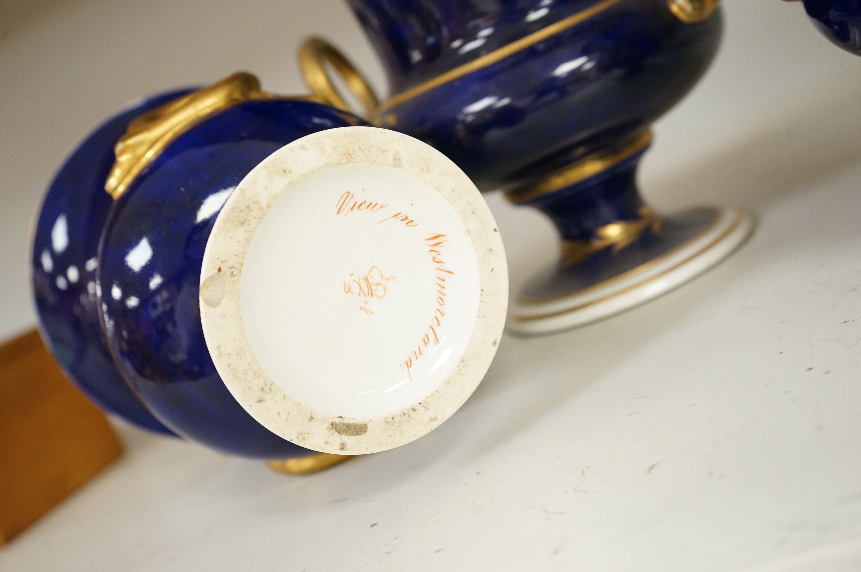A set of three Derby campana vases, painted with named views, circa 1820, tallest 20.5cm